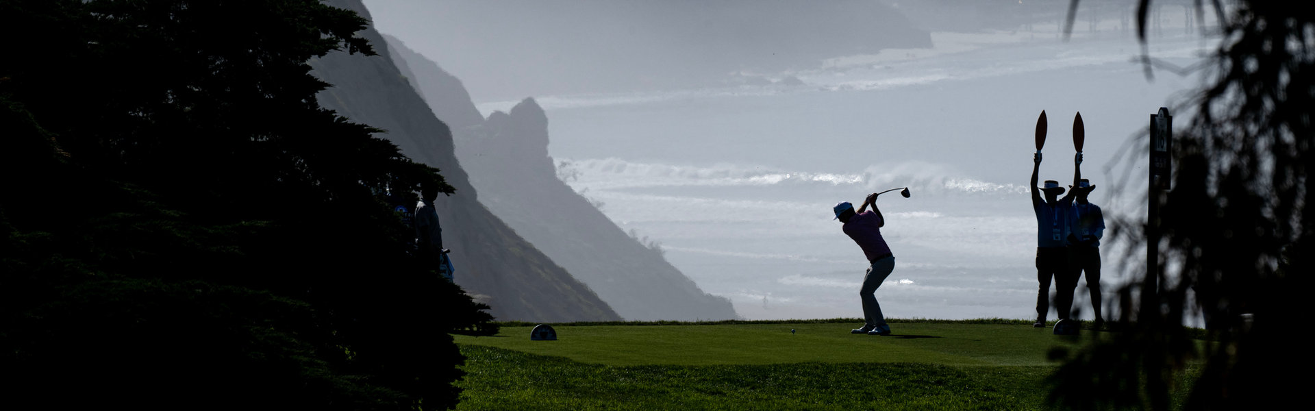 A golfer tees off on the coastal cliffs at Torrey Pines